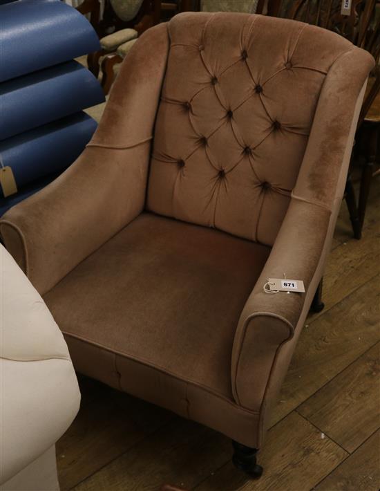 A Victorian buttonback armchair